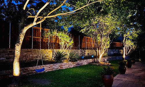 How to Use Lighting to Highlight Trees, Shrubs, and Garden Features